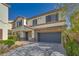 Charming two-story home with a two-car garage, desert landscaping, and stone accents at 8348 Mokena Ave, Las Vegas, NV 89178