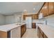 Well-appointed kitchen with a spacious island, stainless appliances, and tile flooring at 8348 Mokena Ave, Las Vegas, NV 89178