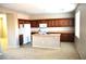 Spacious kitchen with wooden cabinetry, kitchen island and appliances at 8348 Mokena Ave, Las Vegas, NV 89178