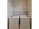 Laundry room showcasing a white washer and dryer set and wire shelving at 8348 Mokena Ave, Las Vegas, NV 89178