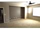 Bright and open living room with neutral carpet, walls and ceiling fan at 8348 Mokena Ave, Las Vegas, NV 89178