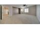 Generously sized bedroom with neutral walls, carpet, and access to hallway, offering versatility and comfort at 8348 Mokena Ave, Las Vegas, NV 89178