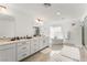 A spacious bathroom with double vanity, bathtub, and walk-in shower at 8415 Iron Heart Ln, Las Vegas, NV 89113