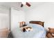 Comfortable bedroom featuring a ceiling fan and ample natural light at 8415 Iron Heart Ln, Las Vegas, NV 89113