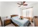 Inviting bedroom with a ceiling fan and soft, sheer curtains at 8415 Iron Heart Ln, Las Vegas, NV 89113
