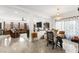Open living space featuring tile floors, decorative chandelier and furniture at 8415 Iron Heart Ln, Las Vegas, NV 89113