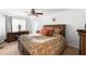 Bright main bedroom with a large window and a ceiling fan at 8415 Iron Heart Ln, Las Vegas, NV 89113