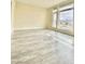 An empty bedroom with a large window and laminate flooring providing views of the surrounding area at 8925 W Flamingo Rd # 310, Las Vegas, NV 89147