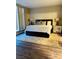 Cozy bedroom featuring a comfortable bed, a stylish area rug and bedside tables with lamps at 8925 W Flamingo Rd # 310, Las Vegas, NV 89147