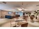 Spacious community lounge with comfortable seating, tables and chairs, and TVs for entertainment at 8925 W Flamingo Rd # 310, Las Vegas, NV 89147