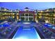 Spectacular pool and spa area surrounded by lounge chairs, cabanas, and manicured landscaping at 8925 W Flamingo Rd # 310, Las Vegas, NV 89147