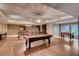 Spacious recreation room featuring a pool table, foosball table, and ample seating for entertaining at 8925 W Flamingo Rd # 310, Las Vegas, NV 89147