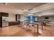 Spacious rec room with stainless refrigerator, pool table, ample counter space, and modern plank floors at 8925 W Flamingo Rd # 310, Las Vegas, NV 89147