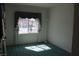 Simple yet elegant room featuring a large window with custom valance for bright natural light at 8982 Emerald Waters Ct, Las Vegas, NV 89147