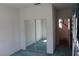 Cozy bedroom with mirrored closet and a glimpse of the staircase, offering ample storage at 8982 Emerald Waters Ct, Las Vegas, NV 89147