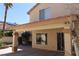 The backyard has a covered patio attached to the home with stucco columns at 8982 Emerald Waters Ct, Las Vegas, NV 89147