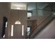 Bright foyer showcasing soaring ceilings, staircase, and glass-accented front door at 8982 Emerald Waters Ct, Las Vegas, NV 89147