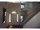 Inviting foyer with a grand staircase, decorative lighting, and a welcoming entrance at 8982 Emerald Waters Ct, Las Vegas, NV 89147