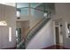 Spacious foyer featuring a grand staircase and elegant chandelier at 8982 Emerald Waters Ct, Las Vegas, NV 89147