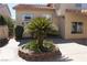 Charming front yard featuring a landscaped garden and a well-maintained lawn at 8982 Emerald Waters Ct, Las Vegas, NV 89147