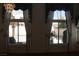Bright living room with large windows dressed in elegant draperies, showcasing the outdoor views at 8982 Emerald Waters Ct, Las Vegas, NV 89147