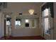 Open-concept living room showcasing a modern fireplace and elegant chandelier at 8982 Emerald Waters Ct, Las Vegas, NV 89147