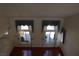 Bright living room with large windows and hardwood floors, from an elevated perspective at 8982 Emerald Waters Ct, Las Vegas, NV 89147