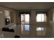 Large tile floored living area with gas fireplace, patio access and lots of natural light at 8982 Emerald Waters Ct, Las Vegas, NV 89147