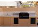 Outdoor kitchen featuring a built-in sink, grill, and counter space at 8982 Emerald Waters Ct, Las Vegas, NV 89147