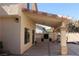 A covered patio leads to an outdoor kitchen featuring a built-in grill and ample counter space at 8982 Emerald Waters Ct, Las Vegas, NV 89147