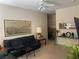 Comfortable living room with neutral walls, plush carpets, and black leather sofa at 9000 Las Vegas Blvd # 1271, Las Vegas, NV 89123