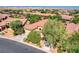 Aerial view of a home with a well-manicured lawn and a three-car garage at 9092 National Park Dr, Las Vegas, NV 89178