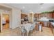 Bright eat-in kitchen with a breakfast table, cherry cabinets, and tile flooring at 9092 National Park Dr, Las Vegas, NV 89178