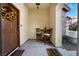 Charming entryway featuring a decorative front door and cozy seating area at 9165 Tudor Park Pl, Las Vegas, NV 89145