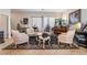 Inviting living room featuring decorative area rug, stylish furniture, and large windows at 9165 Tudor Park Pl, Las Vegas, NV 89145