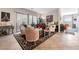 Elegant living room with tile flooring, ornate furniture, and a sliding door to the outside at 9165 Tudor Park Pl, Las Vegas, NV 89145