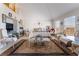 Spacious main bedroom featuring high ceilings, ample natural light, and cozy seating area at 9165 Tudor Park Pl, Las Vegas, NV 89145
