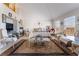 Sunlit main bedroom with cozy seating area and ample space for relaxation at 9165 Tudor Park Pl, Las Vegas, NV 89145