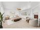 Bright bedroom featuring a fireplace, ceiling fan, and ample natural light at 9788 Altadena St, Las Vegas, NV 89183