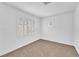 Bright, neutral bedroom featuring carpet flooring, and shuttered windows at 9788 Altadena St, Las Vegas, NV 89183