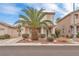 Beautiful two-story home with a well-manicured lawn and desert landscaping in the front yard at 9788 Altadena St, Las Vegas, NV 89183