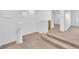 Upstairs hallway with carpeted floors and railing at 9788 Altadena St, Las Vegas, NV 89183