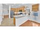 Bright kitchen with stainless steel appliances, a breakfast bar, and ample counter space at 9788 Altadena St, Las Vegas, NV 89183