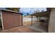 Backyard featuring brown shed and covered patio space at , Las Vegas, NV 89103