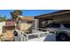Exterior view of a single-story home with a carport, trailer, and storage shed in the background at , Las Vegas, NV 89103