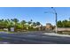 Community entrance with lush landscaping and trees at 1026 Via Saint Andrea Pl, Henderson, NV 89011