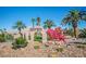 Chimera Golf Club entrance sign with desert landscaping, palm trees, and a red lion statue at 1026 Via Saint Andrea Pl, Henderson, NV 89011