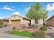 Charming single-story home with desert landscaping and a two-car garage at 1026 Via Saint Andrea Pl, Henderson, NV 89011