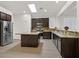 Modern kitchen featuring stainless steel appliances, granite countertops, and a spacious island at 1026 Via Saint Andrea Pl, Henderson, NV 89011