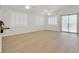 Bright, airy living room with shuttered windows and sliding glass doors at 1026 Via Saint Andrea Pl, Henderson, NV 89011
